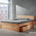Massief houten tweepersoonsbed met rond hoofdbord